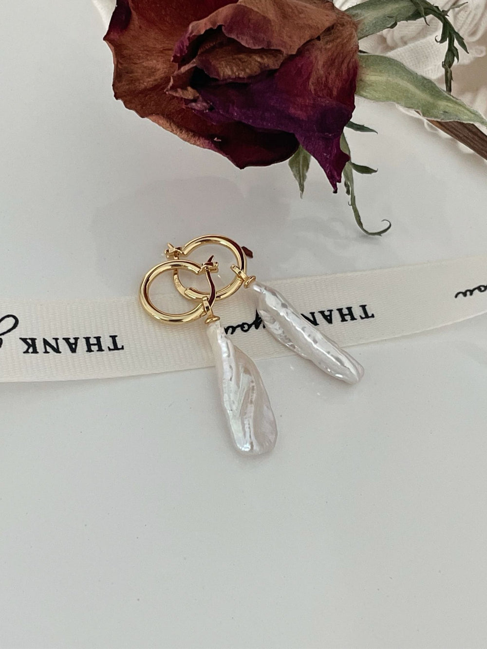 Elegant baroque pearl drop earrings with gold accents, perfect for special occasions