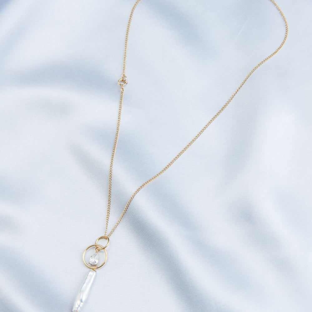 
                      
                        Elegant baroque pearl drop necklace on a delicate gold chain for a sophisticated look
                      
                    