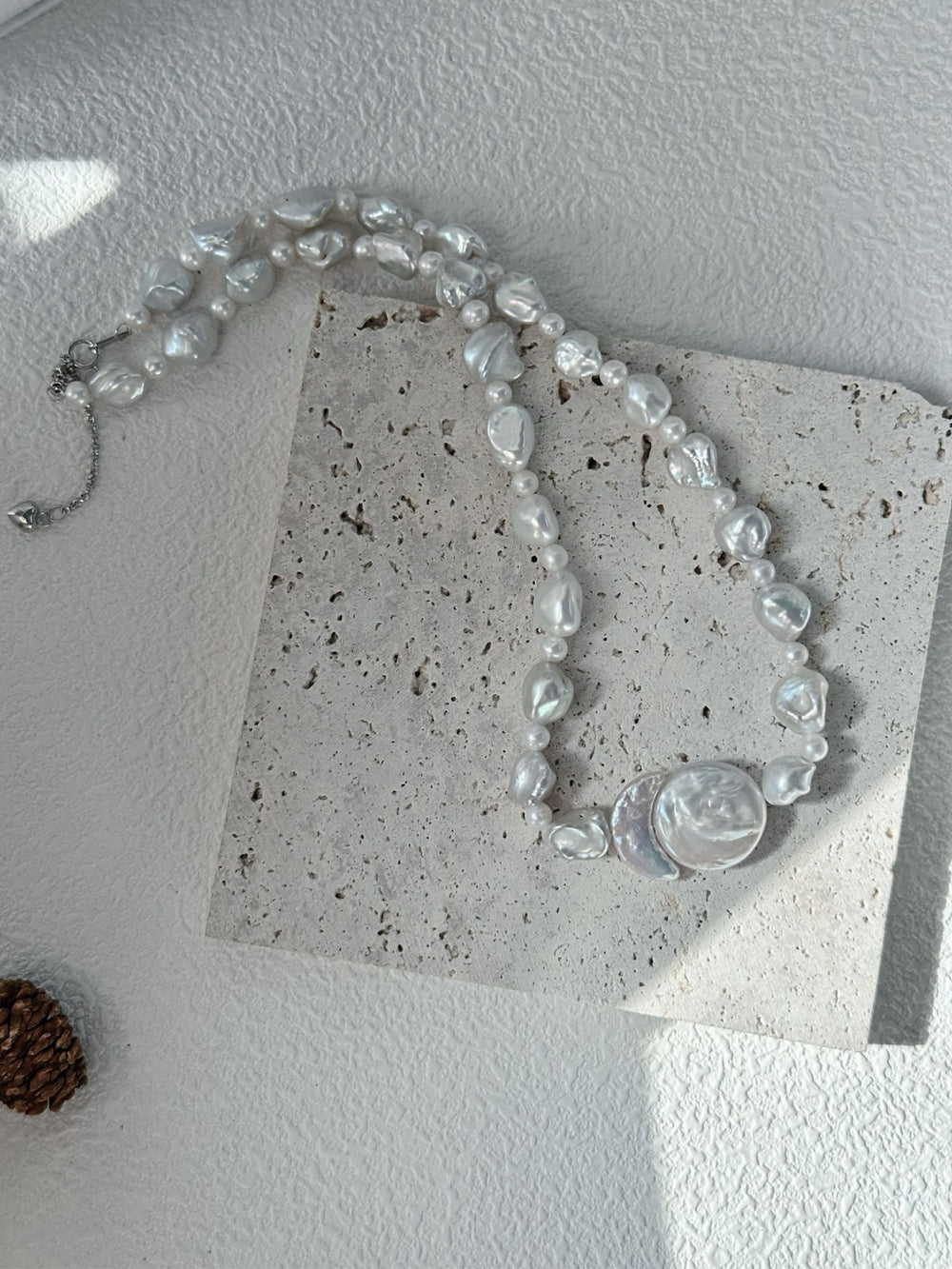 Handcrafted baroque pearl necklace featuring unique luminous pearls in various shapes
