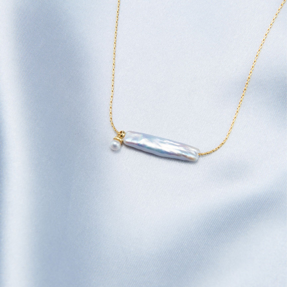 
                      
                        Elegant Pearl Necklace featuring a unique bar design and delicate gold chain
                      
                    