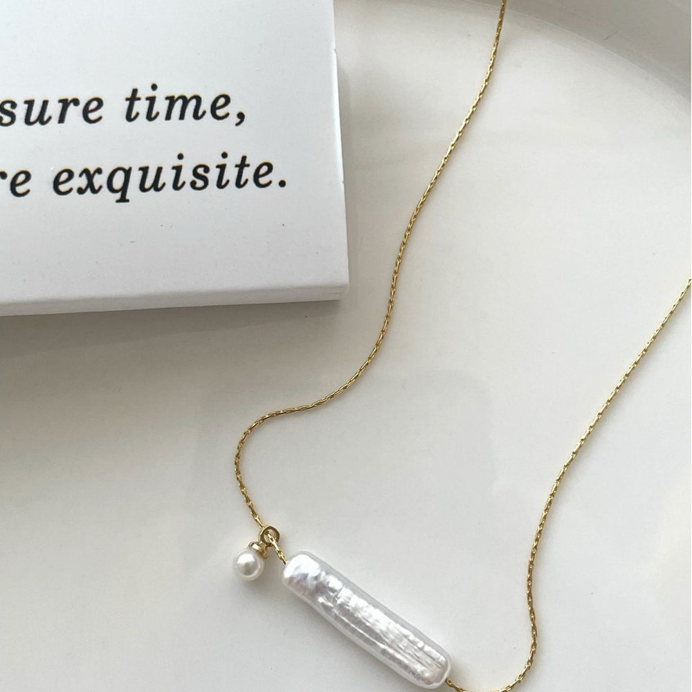 
                      
                        Elegant Pearl Necklace featuring a unique bar-shaped pearl on a delicate gold chain
                      
                    