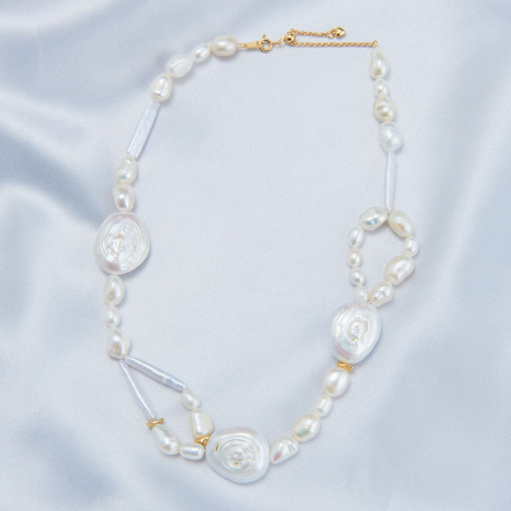 
                      
                        Elegant French baroque pearl necklace with unique shapes and gold accents for a sophisticated look
                      
                    