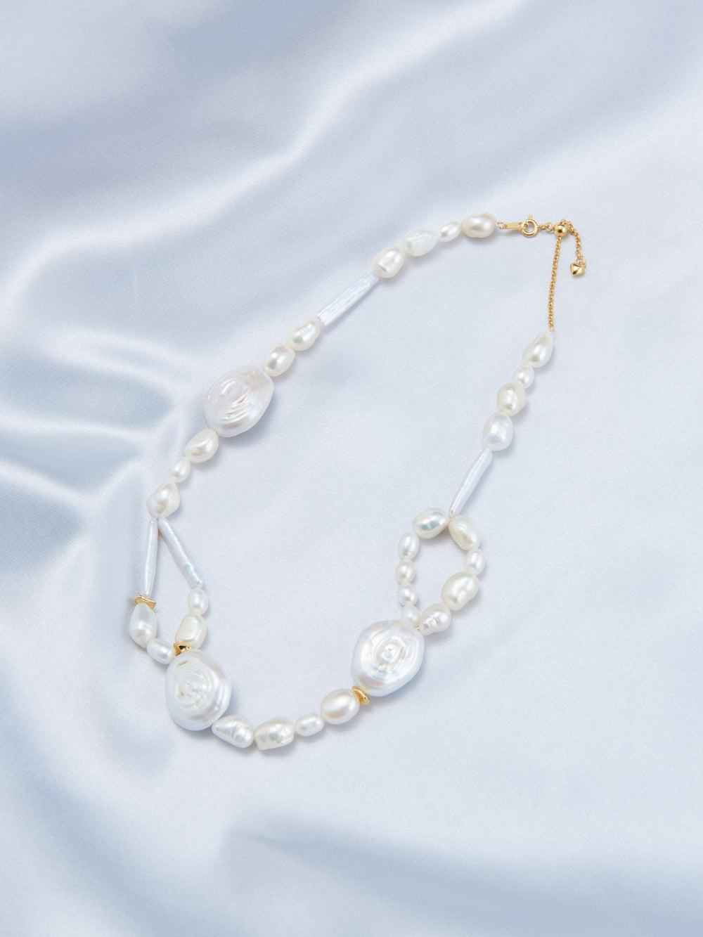 Elegant French baroque pearl necklace featuring unique shapes and a gold clasp