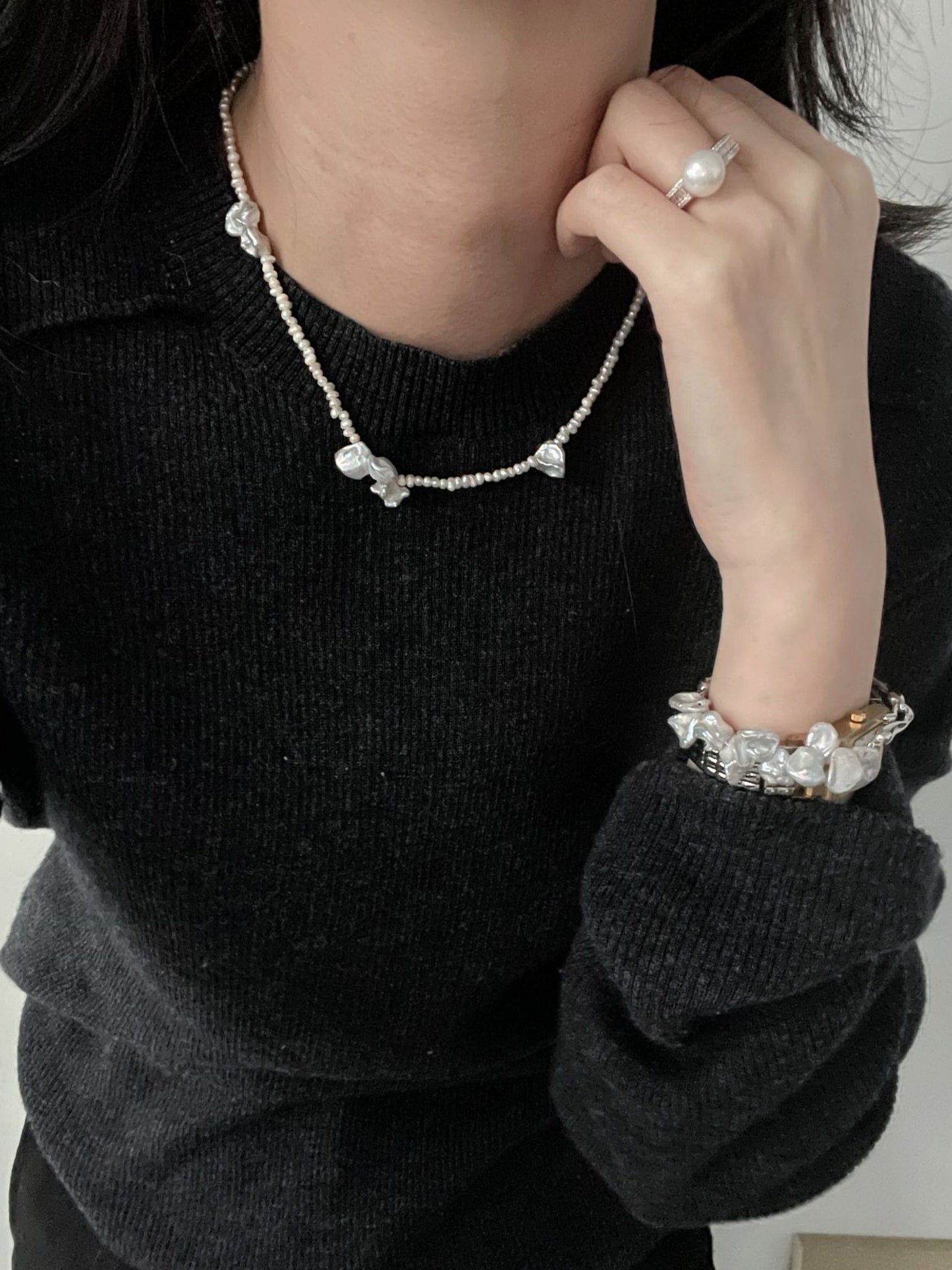 Stylish handcrafted baroque necklace with natural pearls, layered with matching jewelry for a chic look