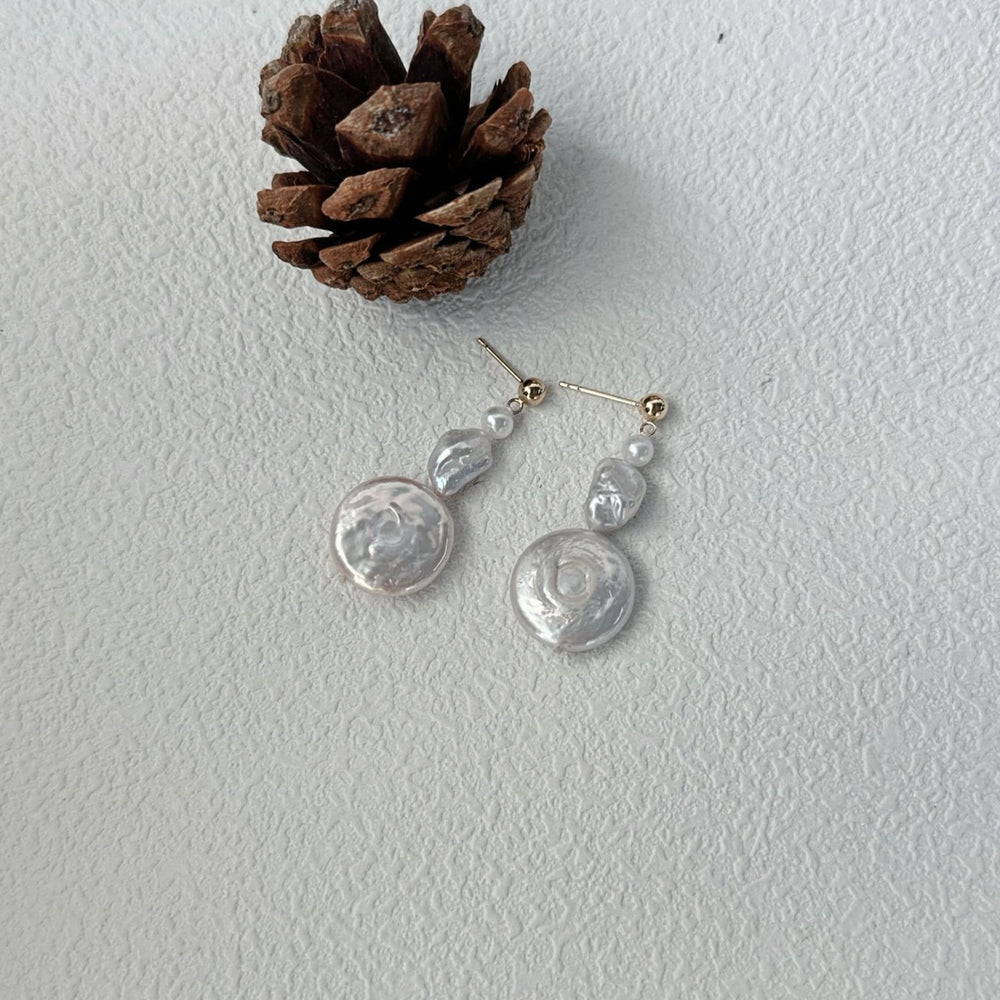 
                      
                        Handmade baroque earrings featuring unique pearls for a stylish and elegant look
                      
                    