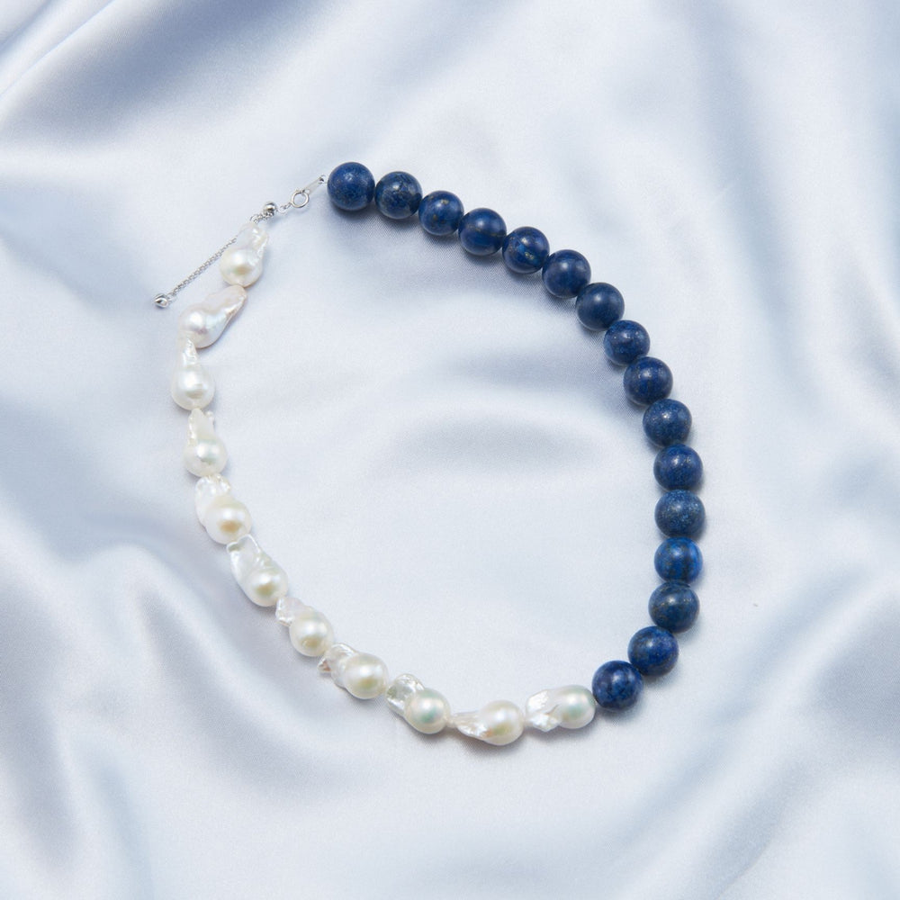 
                      
                        Lapis lazuli Baroque necklace featuring blue lapis and white pearls for an elegant look
                      
                    