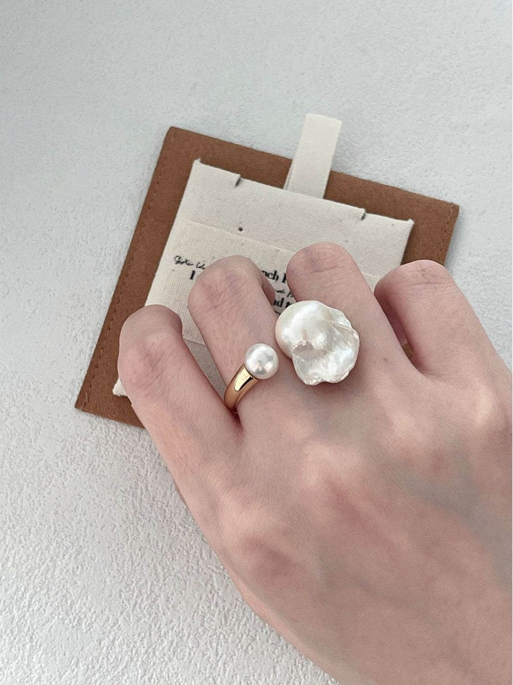 Unique Pearlra Jewelry Pearl and Sculptural Ring Set in Gold on a Hand