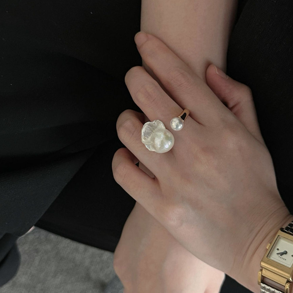 
                      
                        Pearlra Unique Pearl and Gold Ring on Model's Hand for Elegant Jewelry Looks
                      
                    