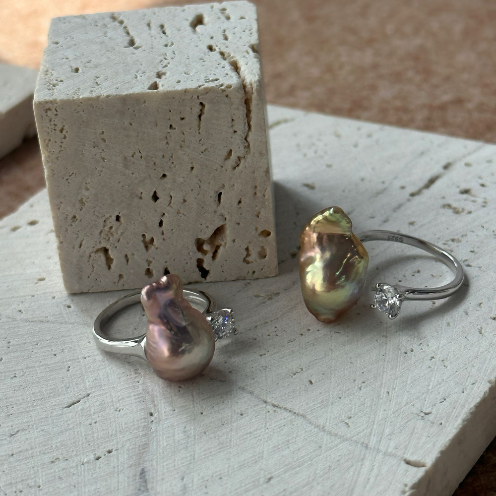 
                      
                        Unique baroque pearl ring set featuring stunning natural shapes and crystal accents on a silver band
                      
                    