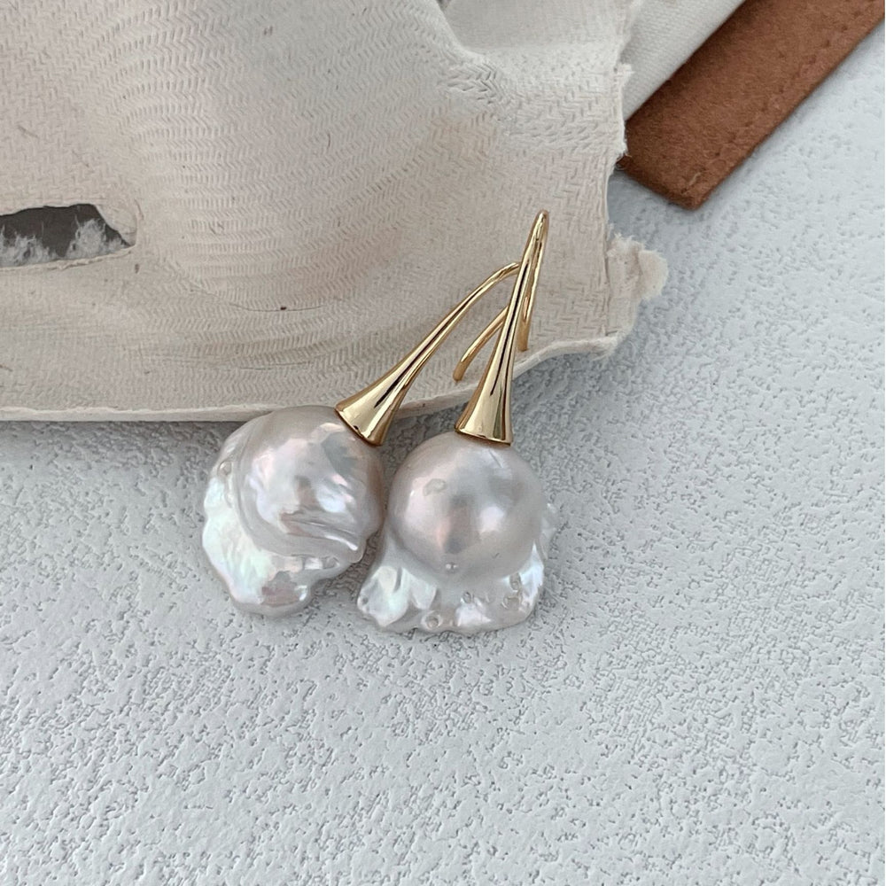
                      
                        Pearlra 18K Gold Plated Baroque Pearl Stud Earrings with unique irregular shaped pearls on white surface
                      
                    